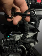 Elastic bungee section on a hands-free dog leash to absorb pulling force and protect the owner’s back.