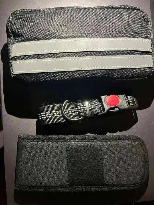 Close-up of the storage pouch on a hands-free dog leash, showing zipper and space for treats or keys.